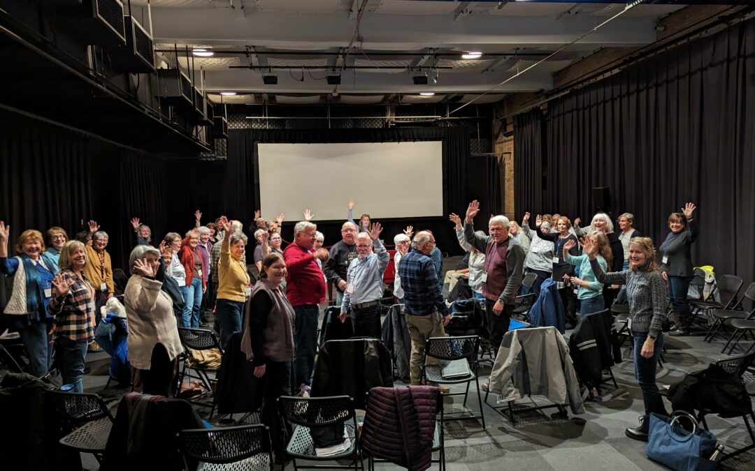 Smiling singers waving from Annapolis ROCKS' kickoff in Spring 2024