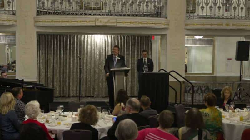 Encore Creativity CEO, Joshua Vickery, and Artistic Director, Brian Fontaine-Isaac, at the podium at Encore's Annual Celebration Brunch in 2024.