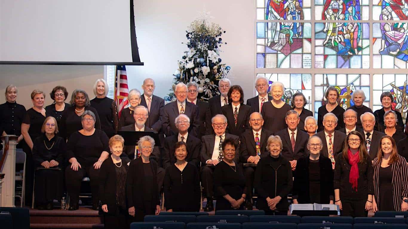 Singers from the Encore Chorale of Southern MD smiling before a concert at Patuxent Presbyterian Church